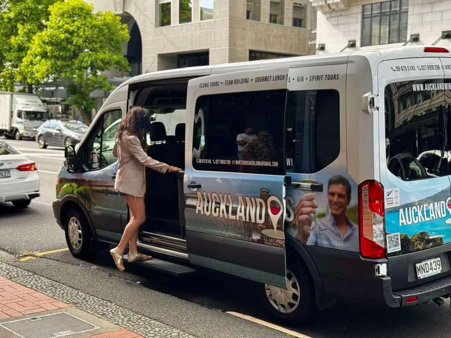 Auckland: Wine region tour with tastings and gourmet lunch - Crossing Auckland Harbour Bridge toward the vineyards