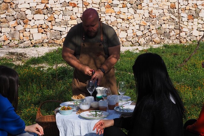 Picnic aperitif in the vineyard of an ancient trullo in Martina Franca - Sunset over the Itria Valley countryside